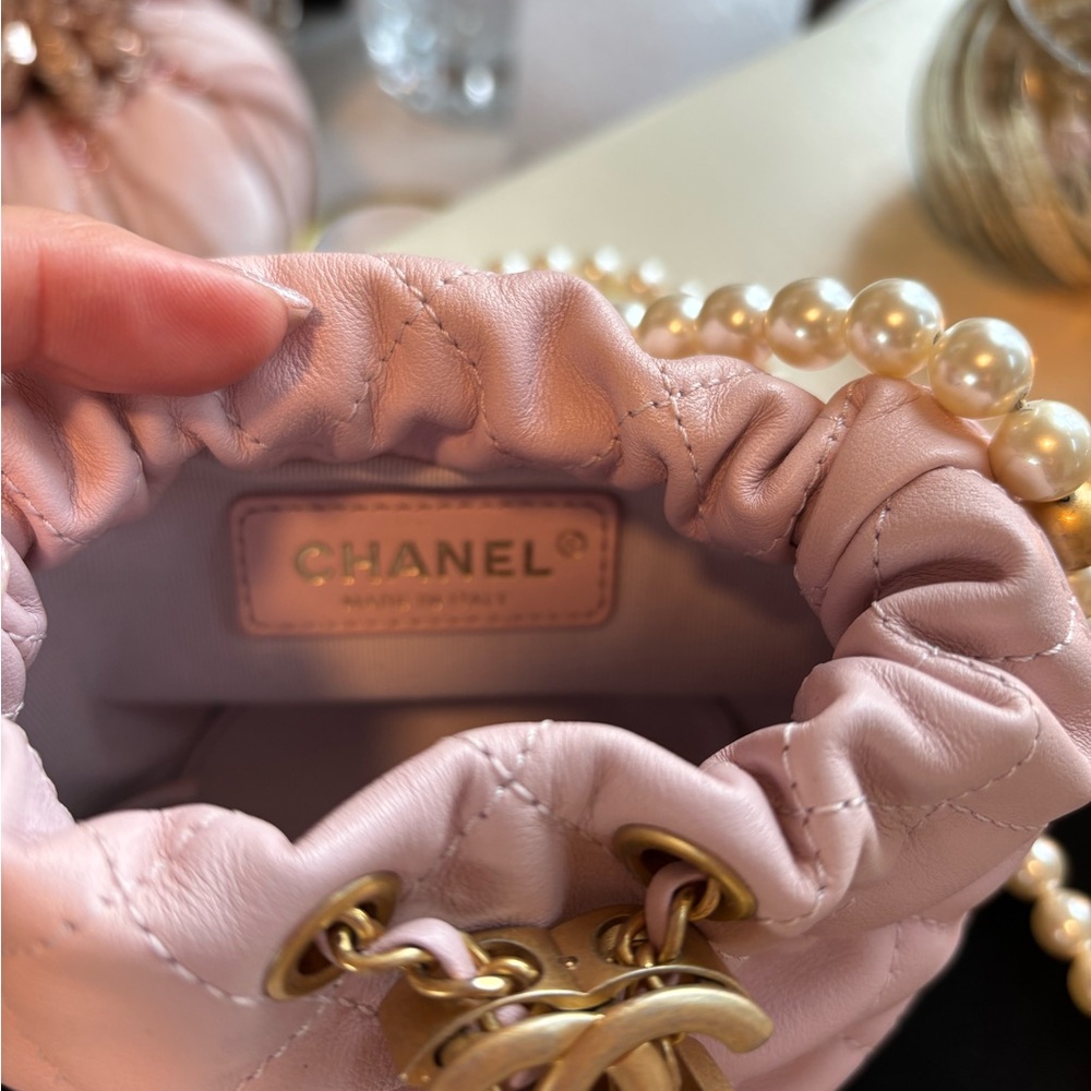 CHANEL Light Pink Quilted Mini Drawstring Bag with Pearl Chain. Never Used. - Picture 13 of 16